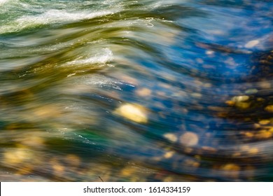 Smooth River Flow In A Transparent Water River.