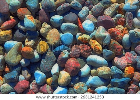 Smooth round wet pebbles texture background. Pebble sea beach close-up. 