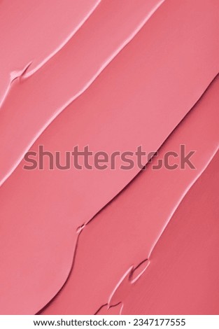 Smooth smudge texture of pink lipstick or paint background