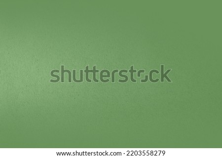 Smooth solid green or green tea color paint on recycled cardboard box with sand texture blank paper background design for website page or organic packaging