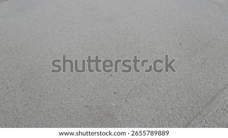 A smooth, unbroken surface of beach sand—perfect for backgrounds, textures, or minimalist design.