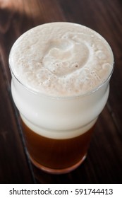 Smooth Unctuous Creamy Home Brew Double IPA Beer Froth Details On A Wood Table