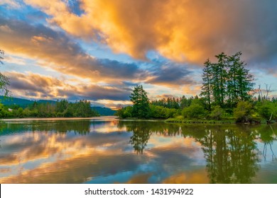 Smooth Waters And Brilliant Sunset Skies Over Puget Sound, Olympia Washington