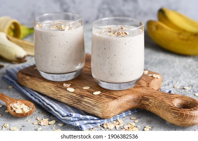 Smoothie With Banana And Oatmeal For Breakfast On A Light Concrete Background. Detox Menu.