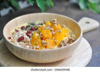 smoothie bowl,mango yogurt with fruit topping or blended mango