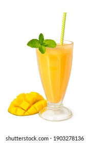 Smoothie of fresh mango and yogurt in a glass decorated with mint leaves isolated on a white background.