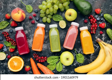 Smoothie in plastic bottles with fruits and vegetables on wooden background - Powered by Shutterstock