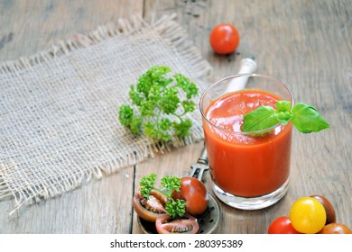 Smoothie Tomato And Basil On A Wooden Background