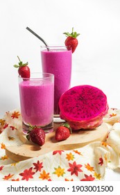 smoothies with dragon fruit, strawberry, and oats, plus milk. on a white background. isolated