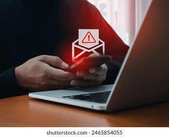 SMS spam and fake text message phishing from scammer concept. SMS hacked warning alert, email hack, scam malware spreading virus on message alert virtual on mobile phone screen in man's hands. - Powered by Shutterstock - Get 15% off with code: PIKWIZARD15