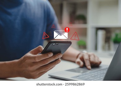 SMS spam, Young man using phone with email inbox alert and spam virus with warning, junk and trash mail and compromised information.