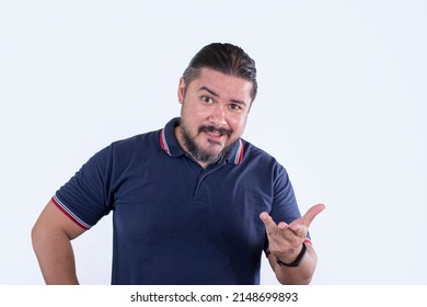 A Smug And Arrogant Man Being A Jerk, Explaining In A Condescending Way. A Male In His Late 30s And Wearing A Blue Polo Shirt. Isolated On A White Backdrop.