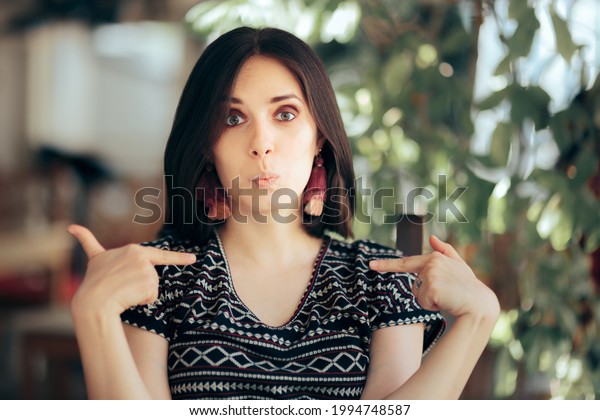 Smug Selfish Vain Woman Pointing to Herself.\
Presumptuous vain egotistic arrogant person being overconfident and\
insufferable full of\
herself\
