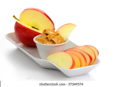 Snack Consisting Of Ripe Apple And Peanut Butter.