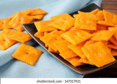 A Snack Dish Of Cheese Flavored Crackers