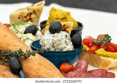snack platter with bread, dips and tomatoes appetizer