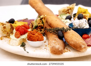 snack platter with bread, dips and tomatoes appetizer
