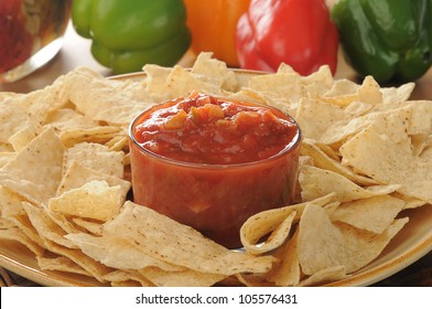 A Snack Tray With Tortilla Strips And Salsa