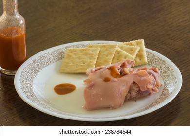 Snacking On Pickled Pigs Foot With Saltine Crackers And Dash Of Louisiana Hot Sauce.  A Soul Food Staple.