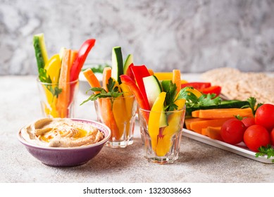 Snacks bar. Healthy vegetables sticks and hummus - Powered by Shutterstock