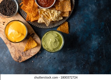 Snacks And Different Types Of Chips With Dip, Salsa, Top View, Rest And Snacks For Beer