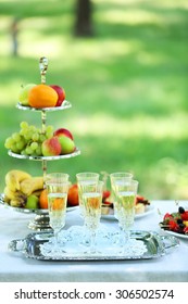 Snacks, Fruits And Drinks On Table, Outdoors. Garden Party Concept