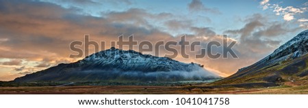 The Snaefellsjokull Volcano in the Snaefellsjokull National Park of Iceland Towers in the Sunset Glow of Late Autumn