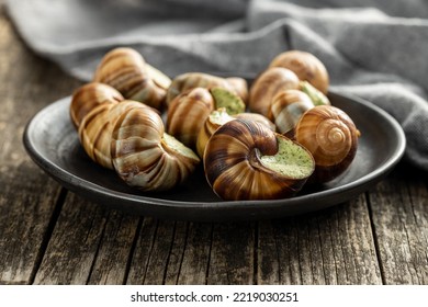Snails with parsley butter, Bourgogne Escargot Snails on the plate. Delikatese food. - Shutterstock ID 2219030251
