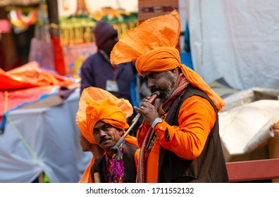 Snake Charmer Performing With Been   To Entertain Crowd In Surajkund Craft Fair At Faridabad, India, February 2020
