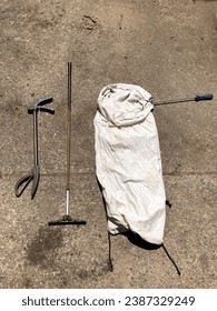 Snake handler catching kit equipment with tongs, grabber, hoop, bag, and hook