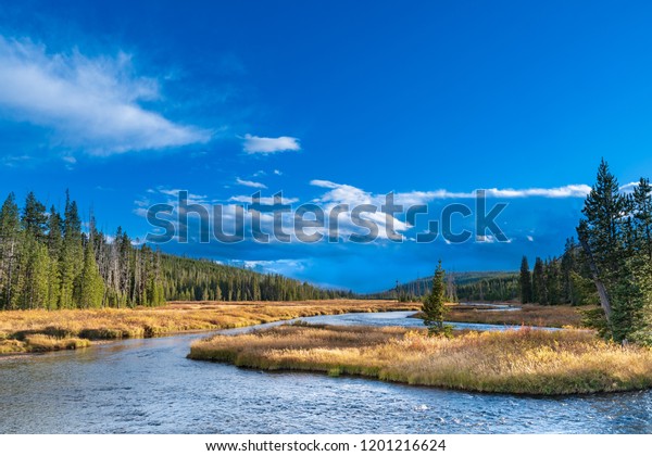 The Snake River is a major tributary of the\
Columbia River and has its headwaters just inside Yellowstone on\
the Two Ocean Plateau. Various stretches of this important river\
have had at least 15 names