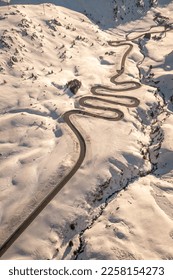 Snake shaped pass road in winter during sunset - Shutterstock ID 2258154273