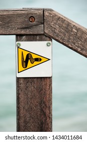 Snake Warning Sign On Beach