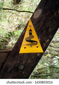 Snake Warning Sign In The Woods