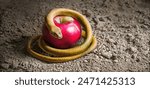 A snake wrapped around an apple as a symbol of temptation