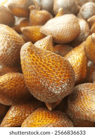 snakefruit. Piles of snake fruit are sold with an attractive appearance