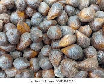 snakefruit. sweet, slightly sour. randomly arranged.