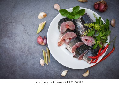 Snakehead Fish For Cooking Food, Striped Snakehead Fish Chopped With Ingredients Herb And Spices On White Plate And Table Kitchen Background, Fresh Raw Snake Head Fish Menu Freshwater Fish