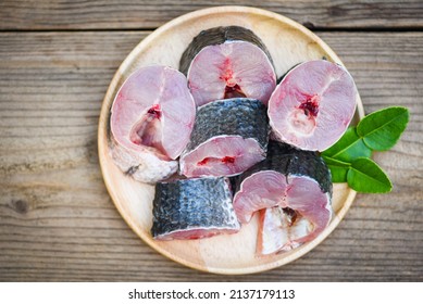 Snakehead Fish For Cooking Food, Striped Snakehead Fish Chopped With Ingredients Kaffir Lime Leaves On Plate And Wooden Table Kitchen Background, Fresh Raw Snake Head Fish Menu Freshwater Fish