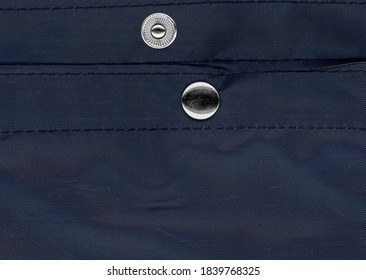 Snap Fastener On Blue Bag Fabric Texture