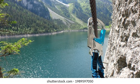 Snap hook on steel rope in via ferrata in Austria - Shutterstock ID 1989597050