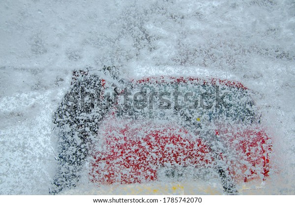 Snap taken from windshield of a car with snow\
flakes all over the\
screen.