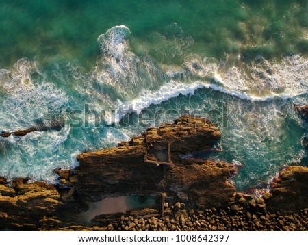 Similar – Aerial Drone View Of Dramatic Ocean Waves Crushing On Rocky Landscape