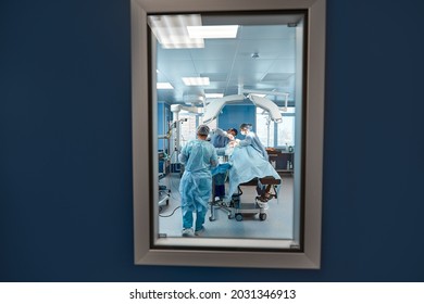 A snapshot at the entrance to the operating room, through the door, operating unit, surgery performing the real operation.