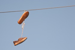 Sneakers Hanging On Electrical Cable