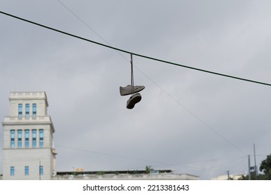 Sneakers Hanging On Electrical Wires. Shoefiti. 