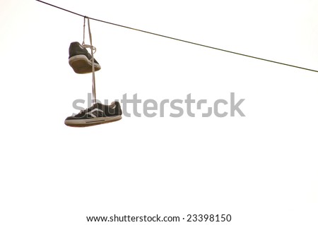 Sneakers hanging on wire