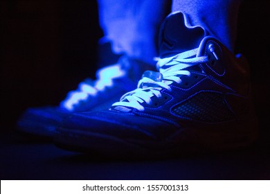 Sneakers Under A Blacklight In The Dark