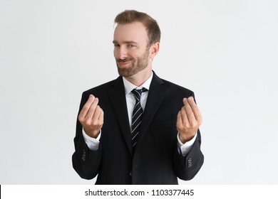 Sneaky Business Man Showing Money Gesture, Asking For Money And Looking At Camera. Payment Concept. Isolated Front View On White Background.