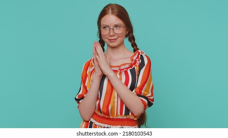 Sneaky Cunning Girl With Tricky Face Gesticulating And Scheming Evil Plan, Thinking Over Devious Villain Idea, Cunning Cheats, Jokes And Pranks. Redhead Teenager Child On Blue Studio Background Alone